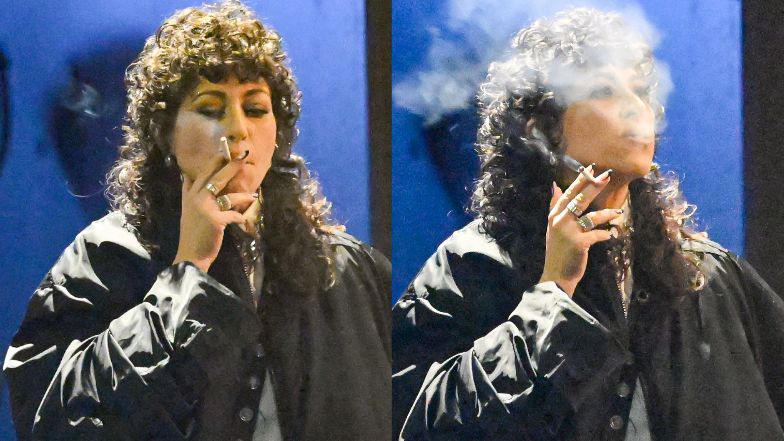 Natalia Kukulska takes a drag on a cigarette