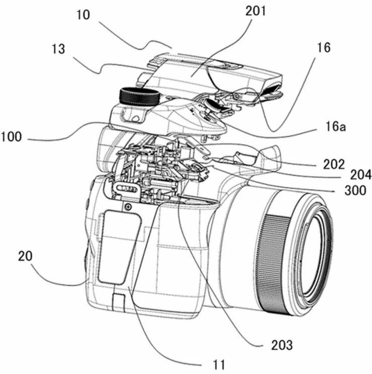 Rysunek techniczny pokazujący mechanizm wibracyjny pod spustem migawki.