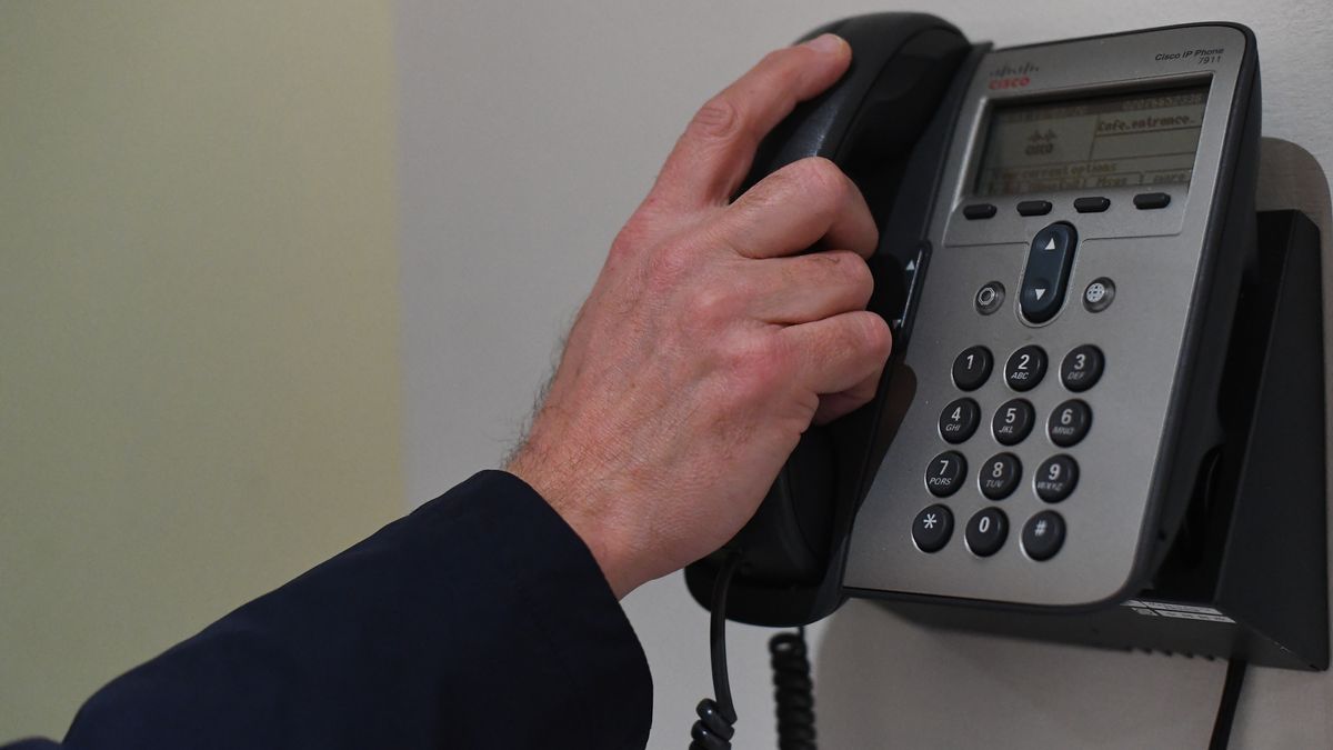 A picture posed by a model of a man using a telephone with a bare hand in London. England's deputy chief medical officer Dr Jenny Harries has said that "many thousands of people" would contract coronavirus as the disease continued to spread in the UK. PA Photo. Picture date: Wednesday March 11, 2020. See PA story HEALTH Coronavirus. Photo credit should read: Victoria Jones/PA Wire (Photo by Victoria Jones/PA Images via Getty Images)