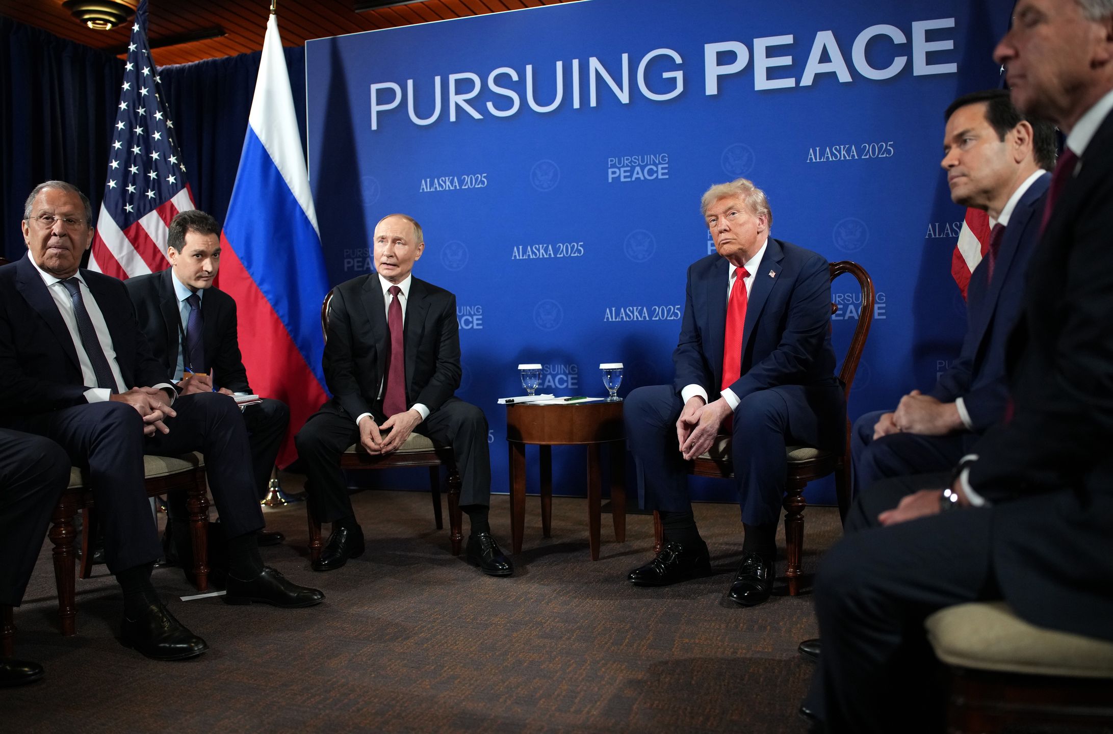 ANCHORAGE, ALASKA - AUGUST 15: U.S. President Donald Trump (R) and Russian President Vladimir Putin (L) hold a meeting at Joint Base Elmendorf-Richardson on August 15, 2025 in Anchorage, Alaska. The two leaders are meeting for peace talks aimed at ending the war in Ukraine. Russian Minister of Foreign Affairs Sergey Lavrov (L) and U.S. Secretary of State Marco Rubio also joined the meeting.  (Photo by Andrew Harnik/Getty Images)