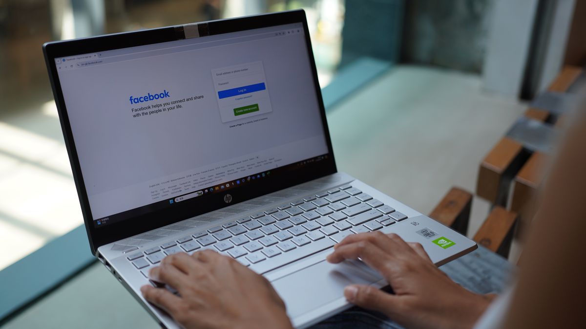 CHINA - 2024/09/03: In this photo illustration, a woman browses facebook website on her laptop. (Photo Illustration by Serene Lee/SOPA Images/LightRocket via Getty Images)