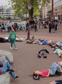 Activists stage unusual protest by playing dead on the ground