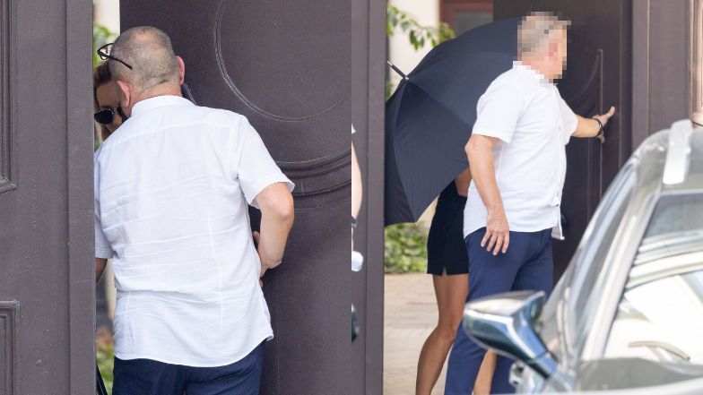 Izabela Janachowska zasłania się parasolem w drodze do samochodu