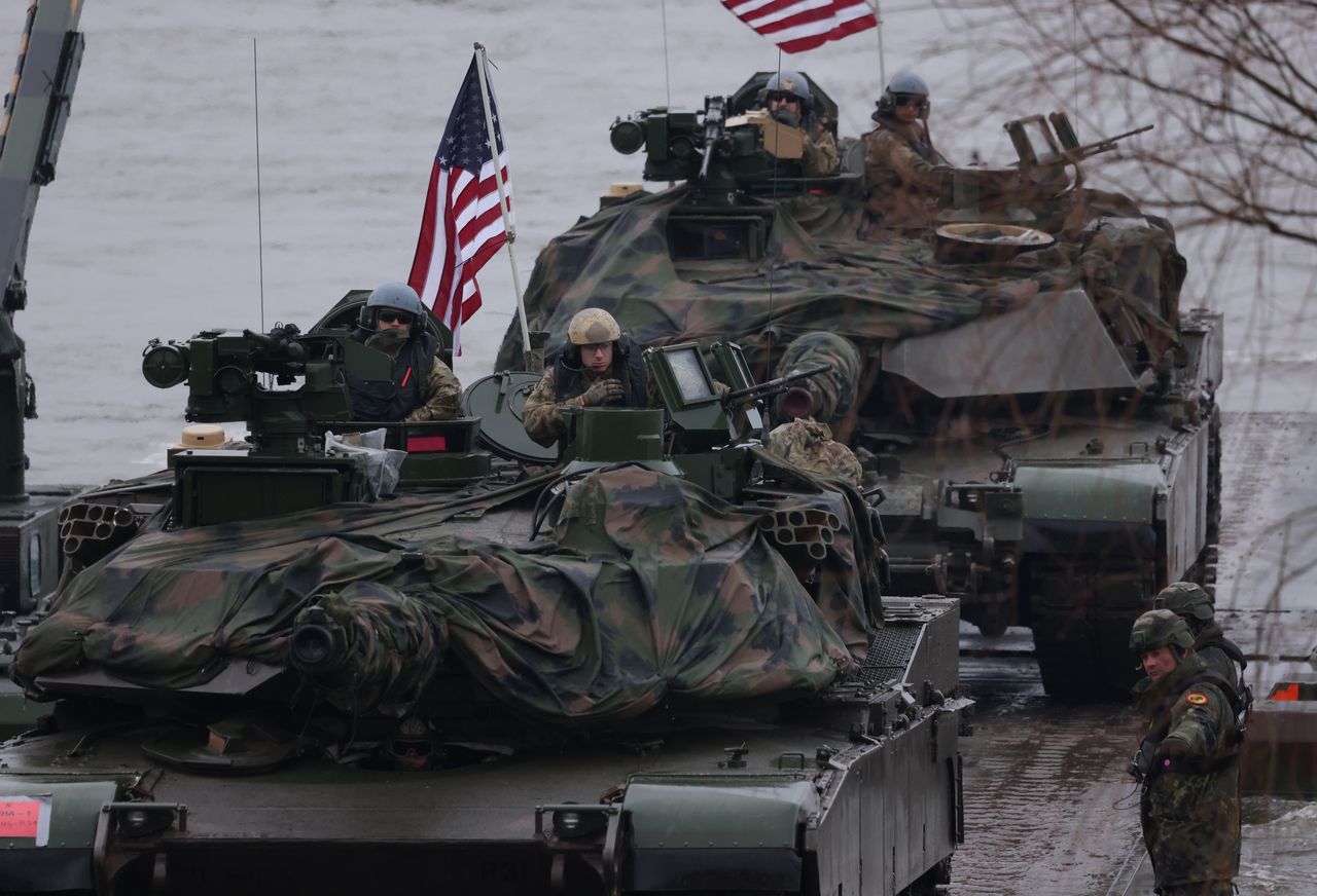 GNIEW, POLAND - MARCH 05: M1A2 Abrams main battle tanks of the U.S. Army arrive on M3 amphibious rigs of the German/British Amphibious Engineer Battalion 130 while crossing the Vistula River during the NATO Dragon 24 military exercise on March 05, 2024 near Gniew, Poland. Dragon 24 is involving troops from 10 different nations and is part of Steadfast Defender, an ongoing set of NATO military manoeuvres across Europe that is involving 90,000 troops. (Photo by Sean Gallup/Getty Images)