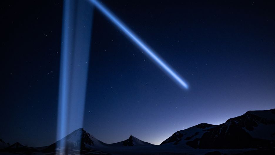 AT SEA, ANTARCTICA - FEBRUARY 23: Light beam and starry sky over snow covered hills shortly after sunset during Turkiye's 7th National Antarctic Science Expedition in Antarctica on February 23, 2023. Under the auspices of the Turkish Presidency, coordinated by the Scientific and Technological Research Council of Turkiyeâs (TUBITAK) Polar Research Institute and under the responsibility of the Turkish Industry and Technology Ministry, the 7th National Antarctic Science Expedition became a rich lab for scientific research for Turkish scientists at the South Pole. In their research on the white continent, atmospheric studies are also being carried out in and around Horseshoe Island. Air quality stations were installed. Astronomical observations including data collection and measurements for mapping with UAV photogrammetry as part of the project were made. Weather could be viewed on the island once the data from the meteorology station was immediately entered on the website of the General Directorate of Meteorology. (Photo by Sebnem Coskun/Anadolu Agency via Getty Images)