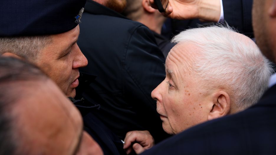 In Warsaw, Poland, on May 10, 2024, former Prime Minister and chairman of the PiS party, Jaroslaw Kaczynski, is attempting to destroy a wreath placed at the Monument to the Victims of the Smolensk Tragedy. On the anniversary of the Smolensk disaster, which resulted in the deaths of 96 people, including Polish President Lech Kaczynski and his wife, Jaroslaw Kaczynski, along with leading PiS MPs, is celebrating a ceremony at the monument. Every month, a group of people also lays a wreath in memory of all the victims and blames President Lech Kaczynski for the plane crash. Former Prime Minister Jaroslaw Kaczynski has destroyed the wreath several times, but this time he is not succeeding. (Photo by Klaudia Radecka/NurPhoto via Getty Images)