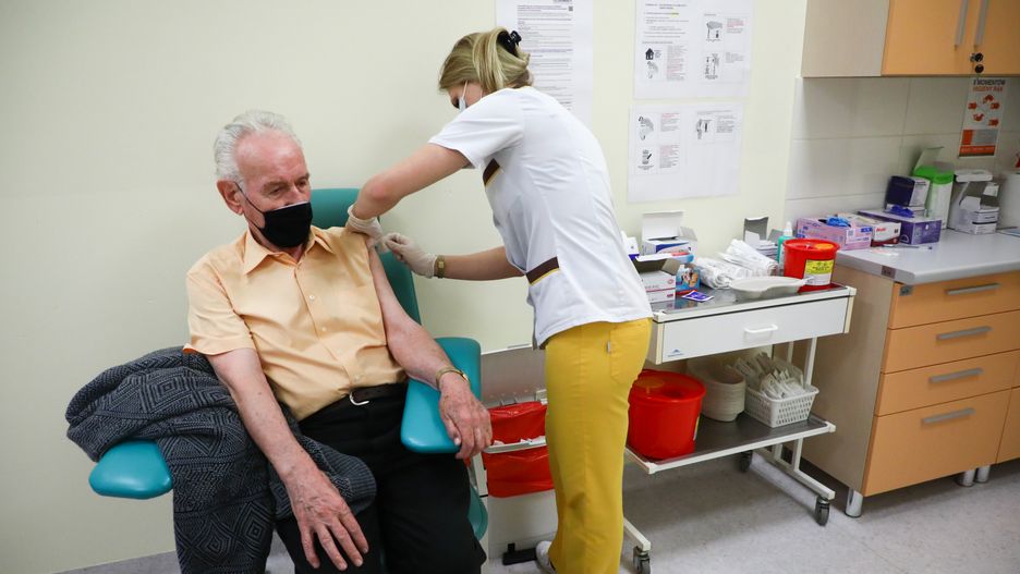 A health worker injects the Pfizer BioNTech vaccine to a 80+ senior citizen at Krakow University Hospital. Krakow, Poland on January 25, 2021.  (Photo by Beata Zawrzel/NurPhoto via Getty Images)
