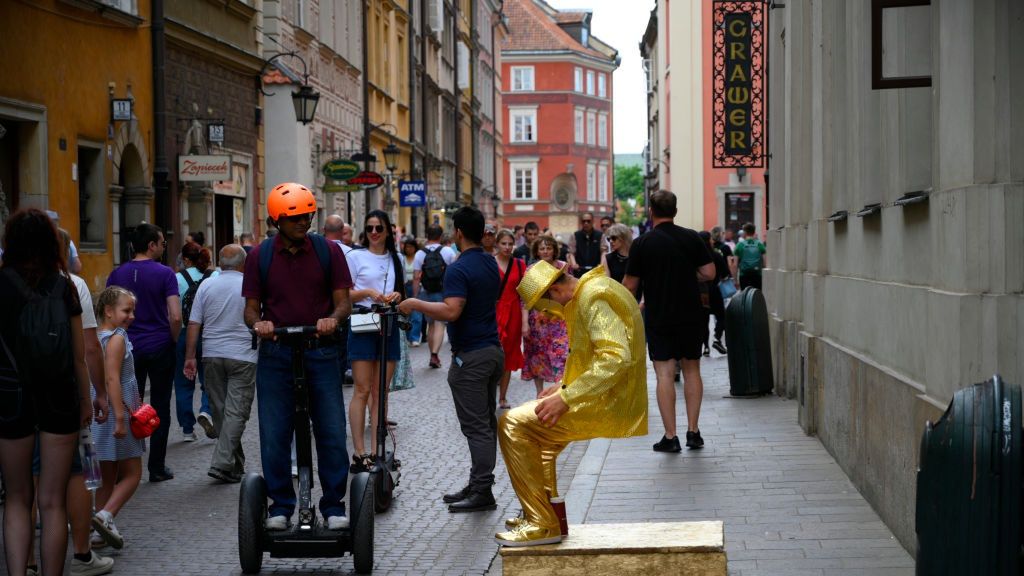 Daily Life In Warsaw
People and tourists are seen in the Old Town in Warsaw, Poland on 19 May, 2024. (Photo by Jaap Arriens/NurPhoto via Getty Images)
NurPhoto
freelance, european travel, city center, gold, scenic views, urban area, jaap arriens, vacation, gig, travel destination, electric, golden, european history, historical landmarks, local attractions, cultural heritage, nurphoto, travle, tourists, daily life, warszawa, public spaces, freeze, sightseeing, money, polska, european capital, busker, historical sites, cobblestone streets