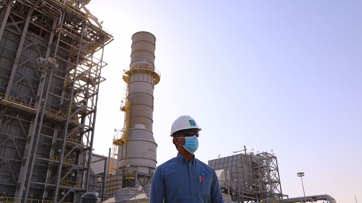 An employee near an oil processing facility at the Khurais Processing Department in the Khurais oil field in Khurais, Saudi Arabia, on Monday, June 28, 2021. The Khurais oil field was built as a fully connected and intelligent field, with thousands of sensors covering oil wells spread over 150km x 40km in order to increase the efficiency of the plant and reduce emississions, according to a Saudi Aramco statement released to the media. Photographer: Maya Sidiqqi/Bloomberg via Getty Images