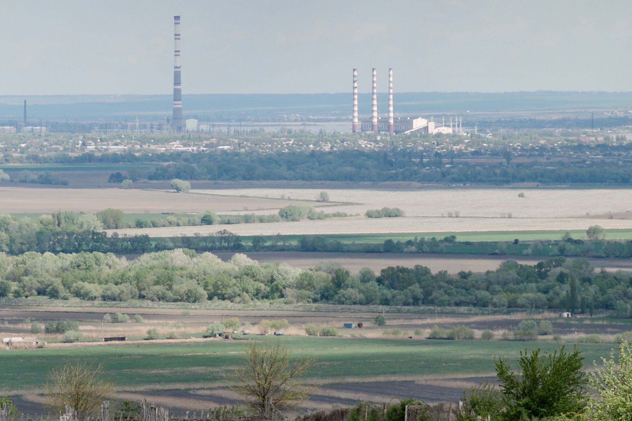 The Cuciurgan power plant, operated by Inter Rao Ues PJSC, in the breakaway pro-Russian territory of Transnistria, beyond the Purcari Wineries Plc vineyard in Purcari, Moldova, on Sunday, May 1, 2022. As the only Moldovan company listed on a foreign stock exchange, Purcari Wineries whose vineyard is located as close as half a mile to the Ukraine border, is a barometer for risk sentiment in the small nation situated precariously on the edge of Russia's war against Ukraine. Photographer: Andrei Pungovschi/Bloomberg via Getty Images