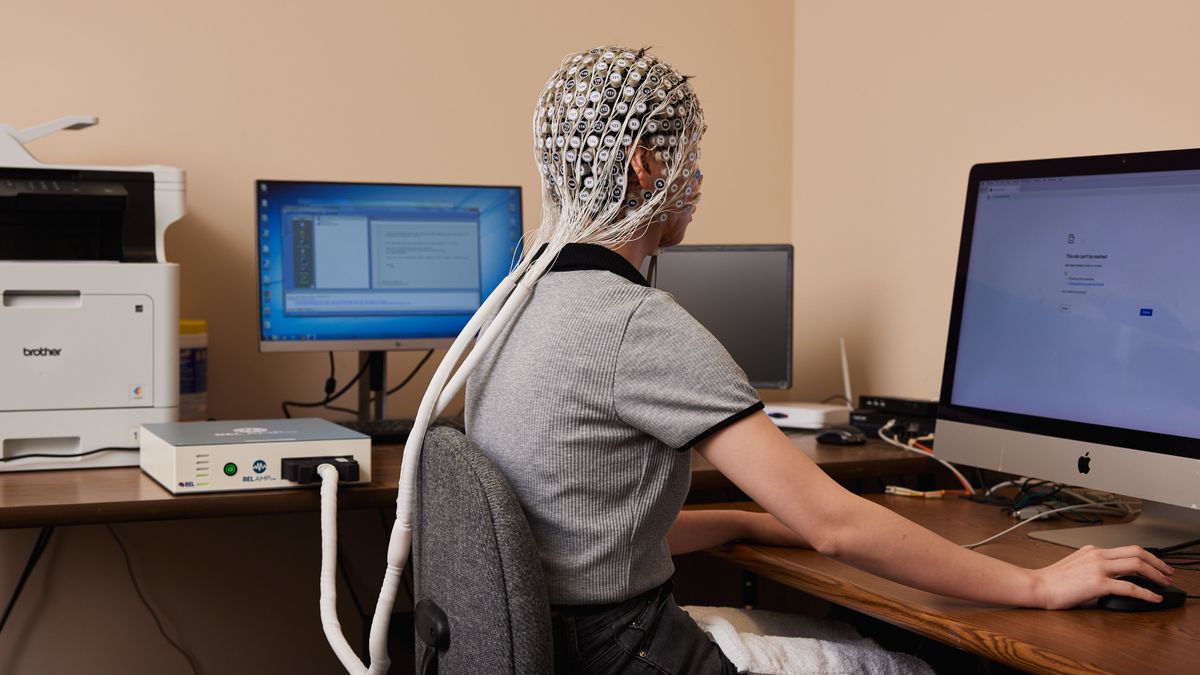 EUGENE, OR - May 19th, 2022: At BEL (Brain Electrophysiology Laboratory) in Eugene, OR Research Laboratory Manager and Test Engineer Shijing Zhou demos the research that is ongoing in the lab using a Geodesic Head Web with 280 electrodes that does standard EEG collection. Their research looks at insomnia, Parkinsons, Alzheimer's and they recently received a grant from the Department of Defense to use their devices to help improve performance in military personnel who have restricted sleep. (Leah Nash for the Washington Post)