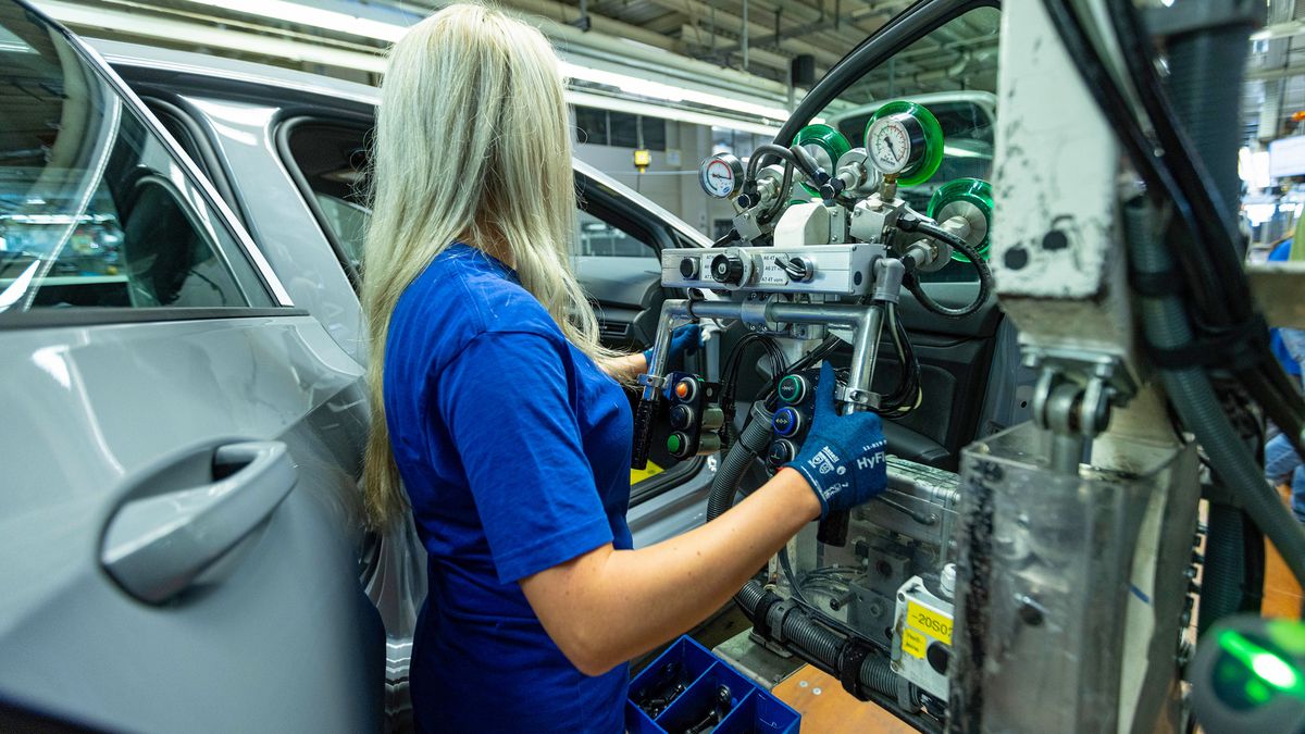 A worker fits a car door to a VW Golf on the assembly line at the Volkswagen AG factory in Wolfsburg, Germany, on Thursday, May 23, 2024. Auto sales in Europe rose 12% in April as manufacturers including Volkswagen AG and Renault SA benefited from robust demand for plug-in and conventional cars in several major markets. Photographer: Krisztian Bocsi/Bloomberg via Getty Images