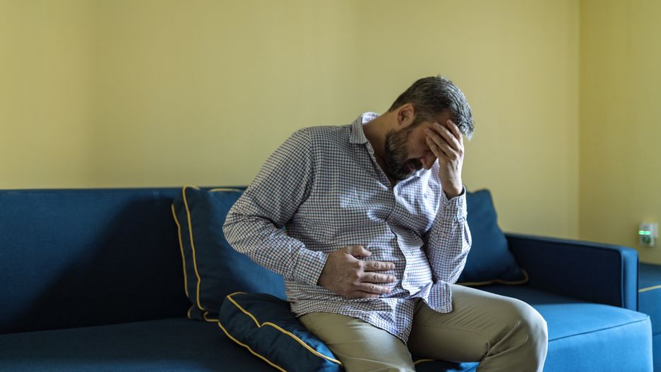 Man Suffering From Stomachache At HomePhoto taken in Belgrade, SerbiaSrdjan Radevic / EyeEmbelgrade, suffering