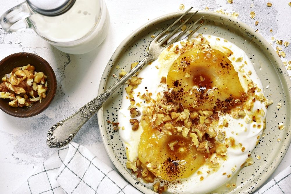 Caramelized,Pear,With,Nuts,And,Yogurt,For,A,Breakfast,Onyogurt,cinnamon,fruit,prepared,recipe,sauce,nut,apple,rustic,pear,white,flat,honey,above,vegetarian,eat,grilled,diet,slate,table,product,caramelized,caramel,natural,lay,overhead,cooked,syrup,spicy,food,meal,walnut,dessert,crumbs,light,healthy,granola,maple,yoghurt,baked,roasted,breakfast,sweet,dairy