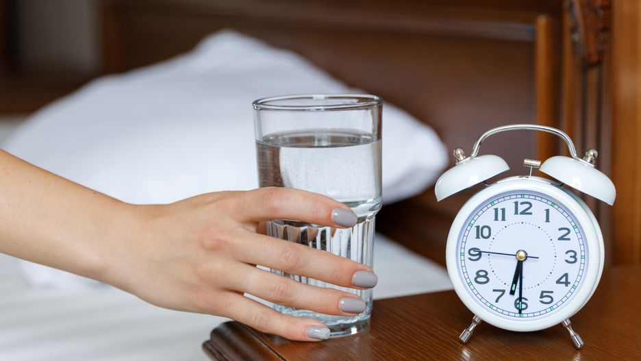 A white alarm clock and a glass of water are on a wooden bedside table. Morning. A woman stretches her hand to a glass of water
A white alarm clock and a glass of water are on a wooden bedside table. A woman stretches her hand to a glass of water
alarm, female, girl, morning, young, bed, clock, drink, glass, water, white, woman, concept, hand, healthy, holding, people, table, time, up, waking, adult, home, healthcare, hour, minute, number, awake, bedroom, blanket, caucasian, lifestyle, background, indoors, pull, take, wake up, sip, clear, arrows, action, daylight