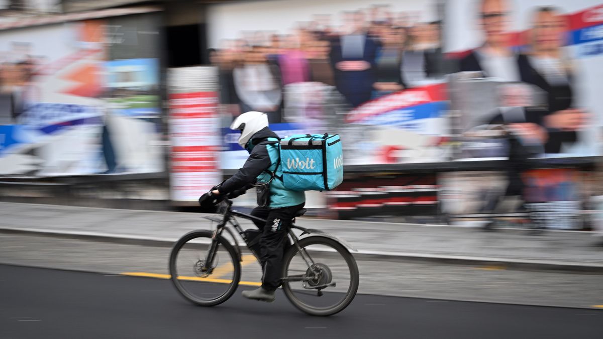 A delivery rider for the Wolt Enterprises Oy food courier service in Belgrade, Serbia, on Wednesday, Dec. 13, 2023. Serbia holds parliamentary elections on Sunday, when President Aleksandar Vucic will seek to extend his ruling party's stay in power until 2027 when his second term expires. Photographer: Oliver Bunic/Bloomberg via Getty Images
