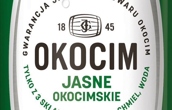 Piwo Okocim z jednolitą szatą graficzną podkreślającą jego tradycję
