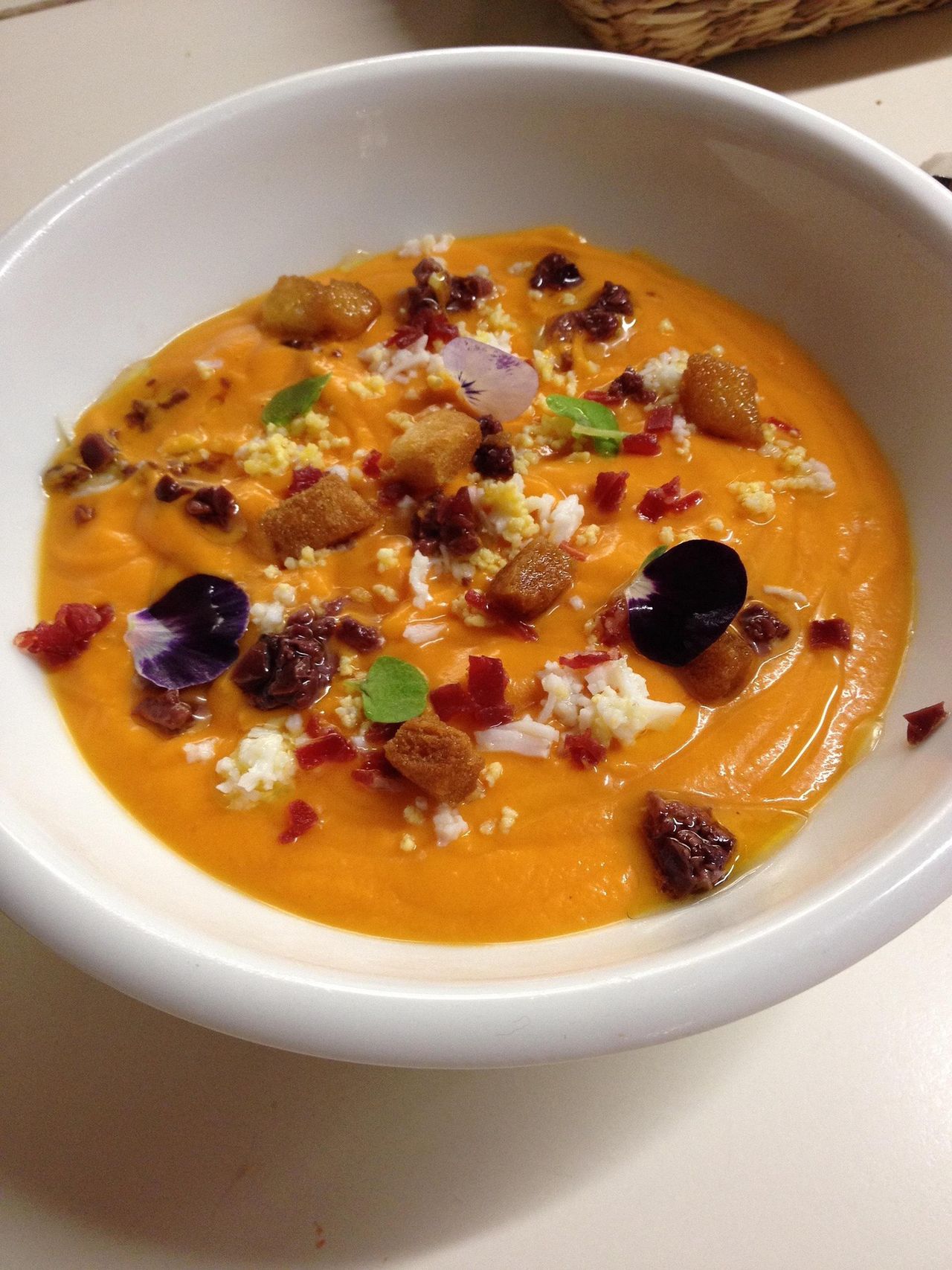 The soup can be served with pumpkin seeds.
