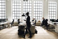 Male and female business colleagues working against window in office
Maskot
co-working space, creative business, start-up