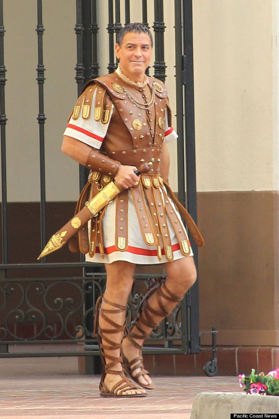 129898, George Clooney smiles as he films scenes for new Coen brothers movie 'Hail, Caesar!' at Union Station. Los Angeles, California - Thursday December4, 2014. Photograph: PacificCoastNews. Los Angeles Office: +1 310.822.0419 sales@pacificcoastnews.com FEE MUST BE AGREED PRIOR TO USAGE