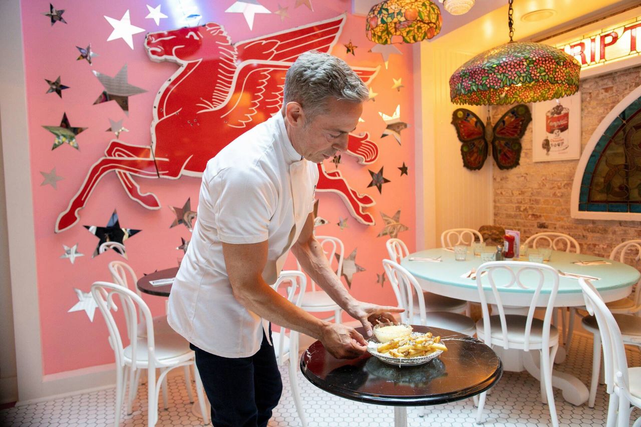 Chef Joe Calderone serves The Creme de la Creme Pommes Frites, the world's most expensive french fries, according to the Guinness Book of World Records, at Serendipity 3 restaurant New York City, New York, U.S., July 23, 2021. Picture taken July 23, 2021. REUTERS/Eduardo Munoz