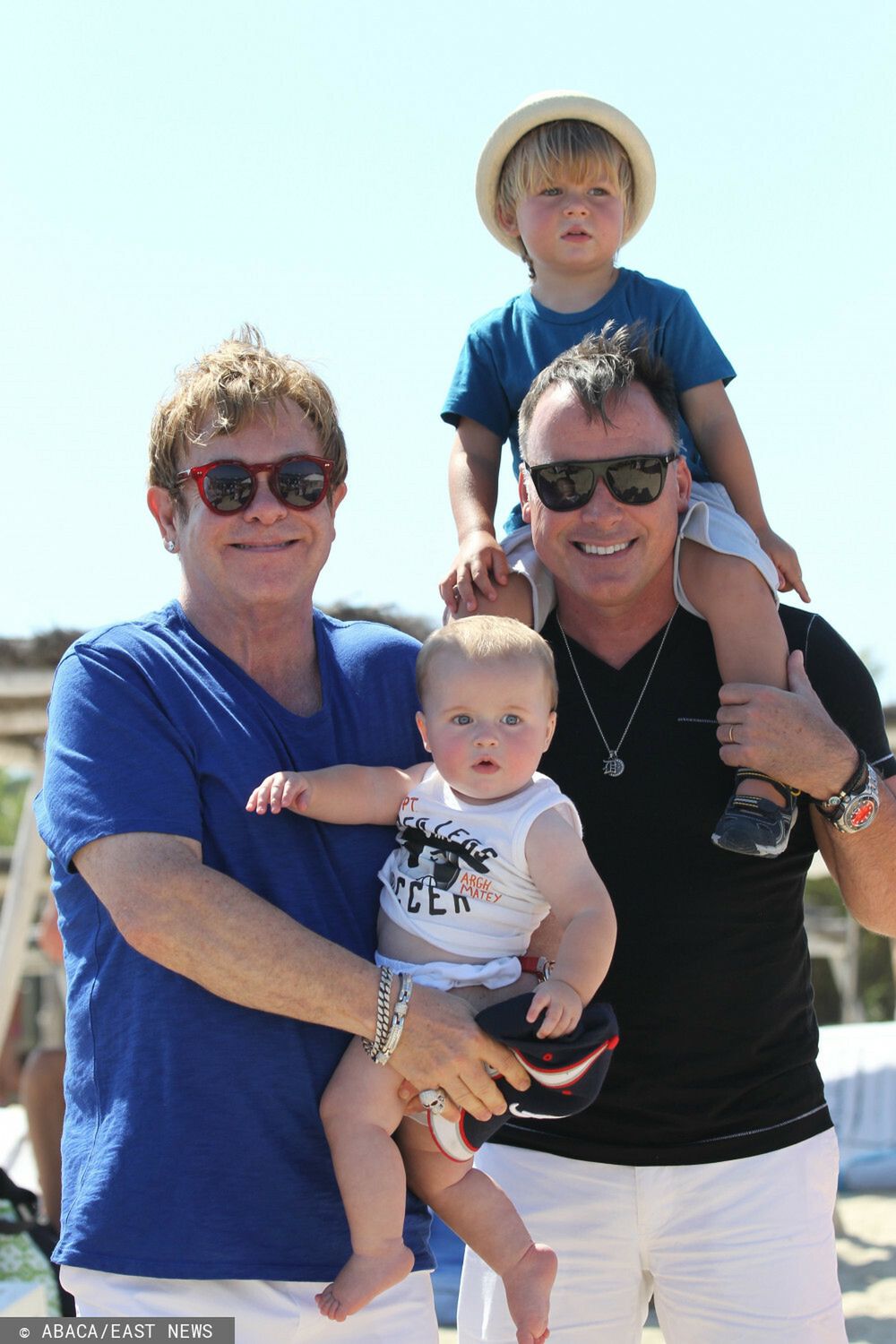 Sir Elton John and his partner David Furnish took their two adopted kids Zachary and Elijah to Club 55 beach restaurant for lunch, in Saint-Tropez, southern France on August 22, 2013. Photo by ABACAPRESS. COM