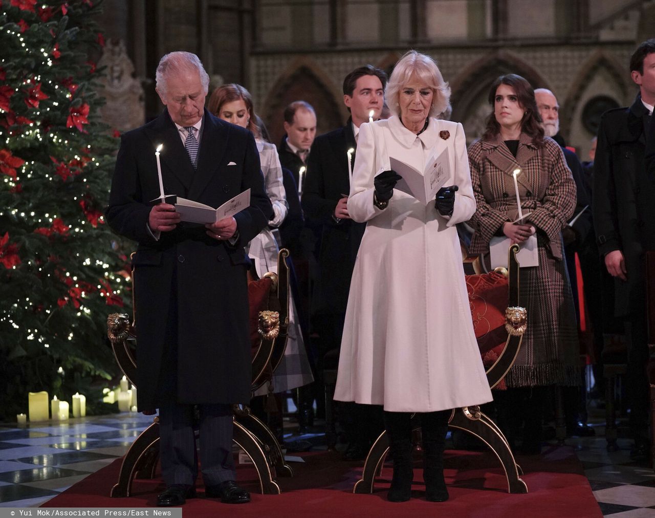 Britain King Charles III and Camilla, the Queen Consort, during the 'Together at Christmas' Carol Service at Westminster Abbey in London Saturday, Dec. 24, 2022. (Yui Mok/Pool via AP)