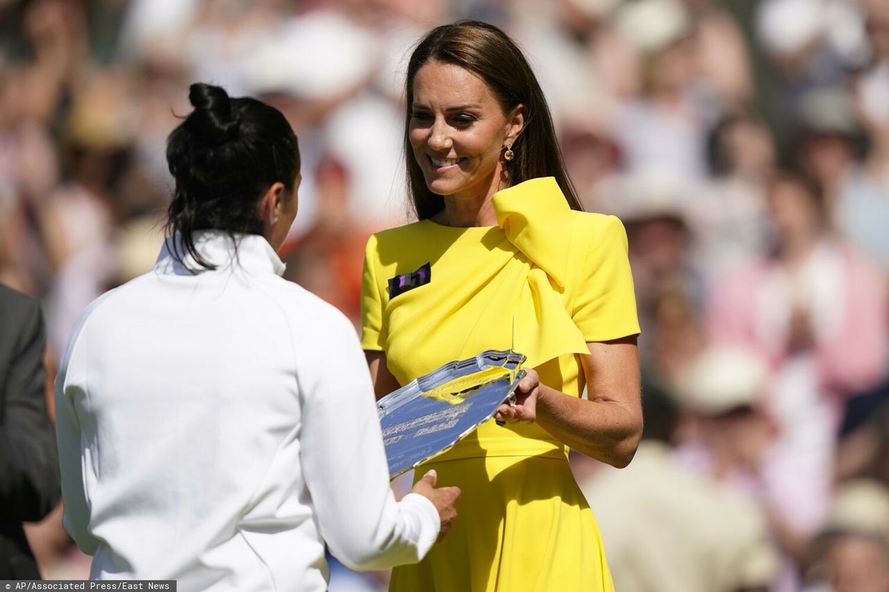 Britain's Kate, Duchess of Cambridge presents the runners-up trophy to Tunisia's Ons Jabeur after the final of the women's singles on day thirteen of the Wimbledon tennis championships in London, Saturday, July 9, 2022. (AP Photo/Gerald Herbert)