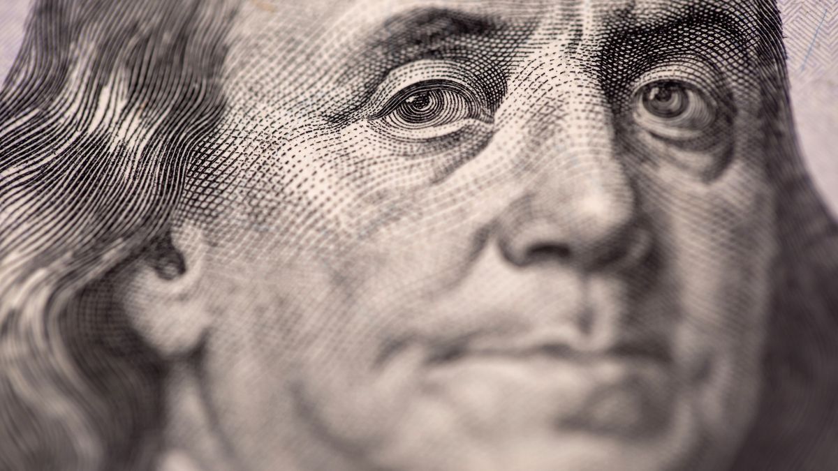The portrait of U.S. founding father Benjamin Franklin is displayed on a U.S. one-hundred dollar banknote in an arranged photograph taken in Hong Kong, China, on Thursday, April 23, 2020. The Hong Kong Monetary Authority intervened for a third straight day this week to defend its currency peg as the local dollar touched the strong end of its trading band. Photographer: Paul Yeung/Bloomberg via Getty Images