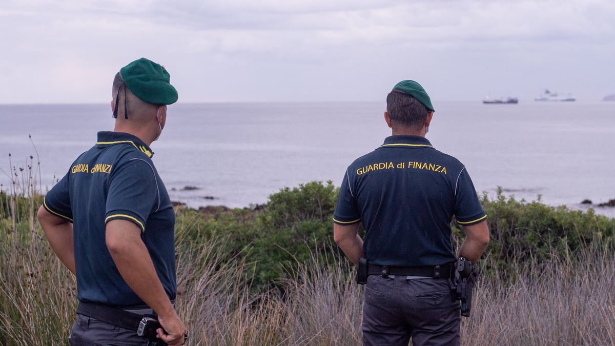 OLBIA, ITALY - SEPTEMBER 25: Two agents of the Guardia di Finanza check the Alan Kurdi ship which has just arrived in the bay of Olbia with 125 migrants on board and awaiting authorization for disembarkation on September 25, 2020 in Olbia, Italy. (Photo by Emanuele Perrone/Getty Images)