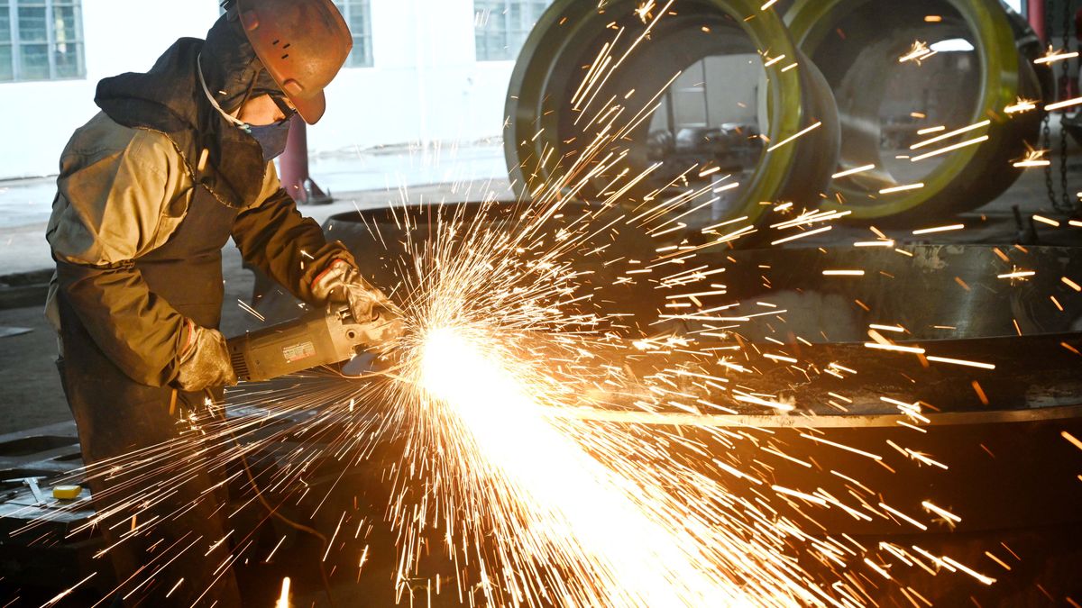 JINHUA, CHINA - FEBRUARY 26: A worker polishes steel at the polishing workshop of Zhejiang Wujing Machine Manufacture Co., Ltd. on February 26, 2024 in Jinhua, Zhejiang Province of China. (Photo by VCG/VCG via Getty Images)