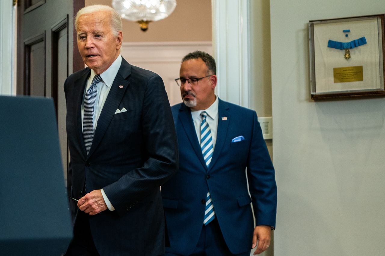 WASHINGTON, DC  June 30, 2023:

US President Joe Biden and United States Secretary of Education Miguel Cardona enters for remarks on the Supreme Court's decision on the Administration's student debt relief program in the Roosevelt Room of the White House on Friday, June 30, 2023.
(Photo by Demetrius Freeman/The Washington Post via Getty Images)