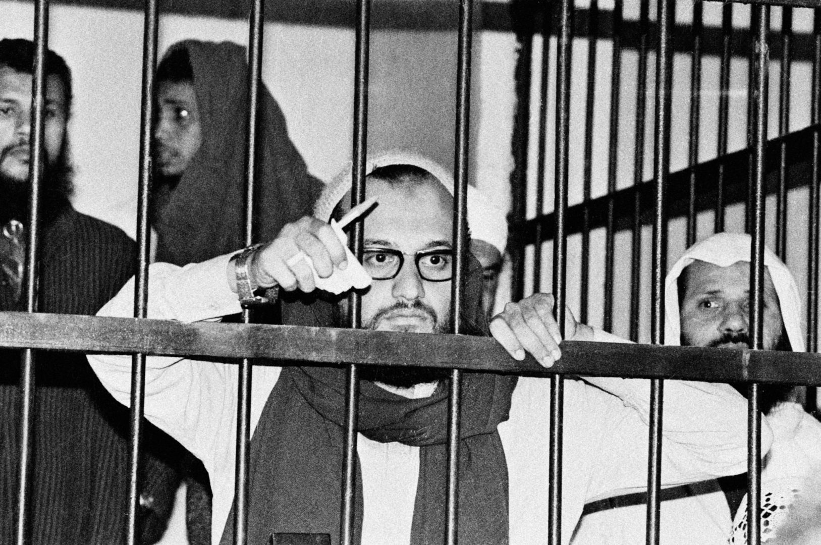 Islamic Jihad Terrorist Ayman Al-ZawahriEGYPT 1982:  (FILE PHOTO)  Ayman Al-Zawahri stands behind bars in an Egyptian court in 1982 during his trial as one of the masterminds behind the assassination of Egyptian president Anwar Sadat in 1981. Al-Zawahri, an Egyptian surgeon, became a member of Egyptian Islamic Jihad in 1981. After three years in jail, convicted of being a member of an illegal Islamic group, Al-Zawahri was expelled from the country.  He travelled to Pakistan, where he met Osama bin Laden. He is now considered to be bin Laden's top lieutenant.  (Photo by Getty Images)Getty ImagesMuslim Jail Politics Terrorist Political US Attack Crime Afterma