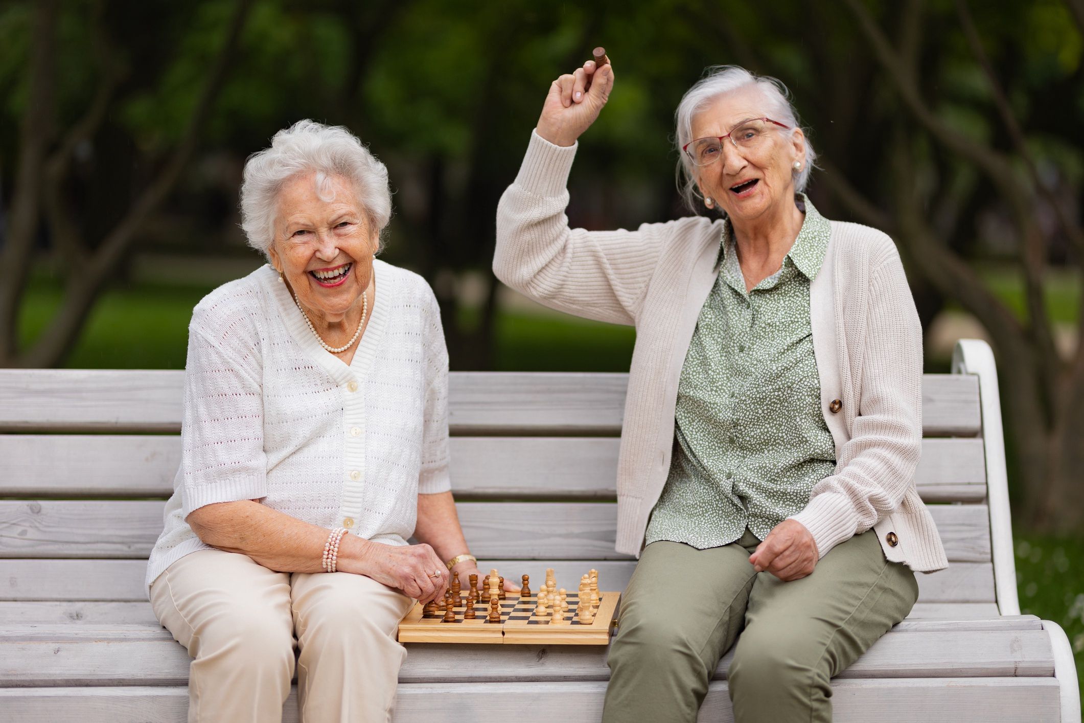 Elderly best friends playing chess in public park, having fun together.
Elderly best friends playing chess in public park, sitting on the park bench. Senior women enjoying free time, having fun together. Two female residents playing chess in nursing home garden. Concept of friendship and free time activities in retirement.
Halfpoint Images