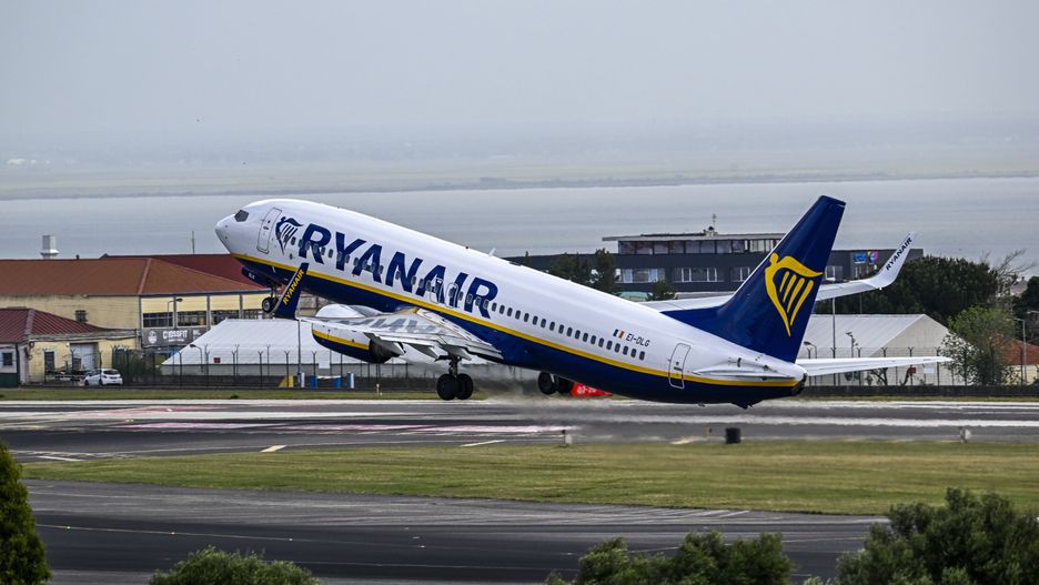 LISBON, PORTUGAL - APRIL 01: A Ryanair aircraft takes off on a busy day in Humberto Delgado International Airport on April 01, 2023, in Lisbon, Portugal. According to the Portuguese National Institute of Statistics (INE), foreign tourists stood out in the overnight stays, totaling 2.7 million in the second month of 2023, up 51 percent year-on-year. The domestic market contributed, in turn, with 1.4 million overnight stays, an increase of 19 percent compared to February 2022. Hotel stays continued to grow in February compared to the same month last year, with 1.7 million guests (a 33 percent increase) and four million overnight stays (a 38.5 percent increase). (Photo by Horacio Villalobos#Corbis/Corbis via Getty Images)