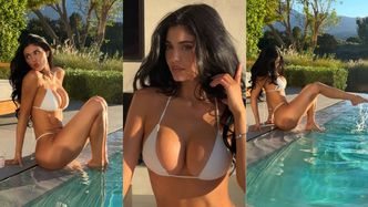 Bikiniara Kylie Jenner i jej podrasowany biust wdzięczą się nad basenem. Prawdziwa syrenka? (ZDJĘCIA)