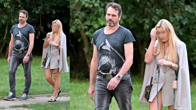 Paweł Deląg z tajemniczą blondynką i jej psem