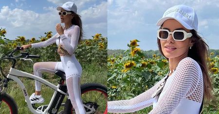 Natalia Siwiec w ażurowym komplecie i z torebeczką Louis Vuitton pod pachą przemierza na rowerze polskie bezdroża (FOTO)