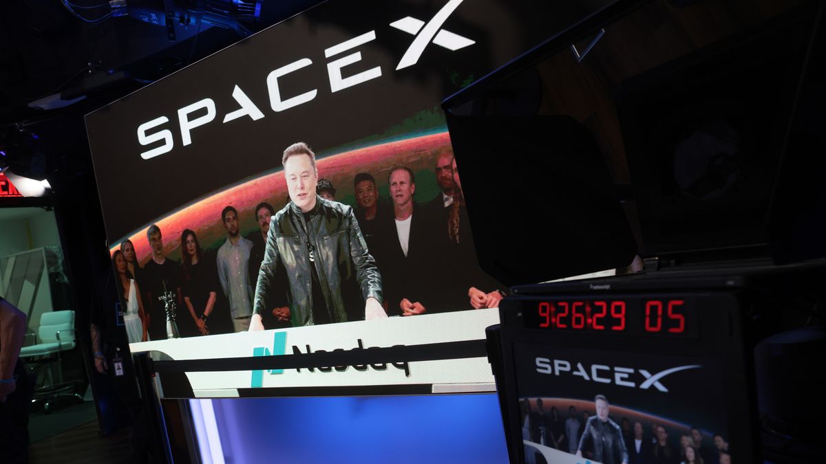 NEW YORK, NEW YORK - JUNE 12: Elon Musk, founder and CEO of SpaceX, speaks via video before the ringing of opening bell at the Nasdaq Marketsite at the launch of the company's initial public offering (IPO) on June 12, 2026 in New York City. SpaceX is set to begin trading under the ticker SPCX following what is expected to be the largest initial public offering in history. Elon Musk, who also serves as chief executive of Tesla, could become the world's first trillionaire. In a filing with the Securities and Exchange Commission, the company said it plans to raise $75 billion by selling 555.6 million shares at $135 each. (Photo by Spencer Platt/Getty Images)