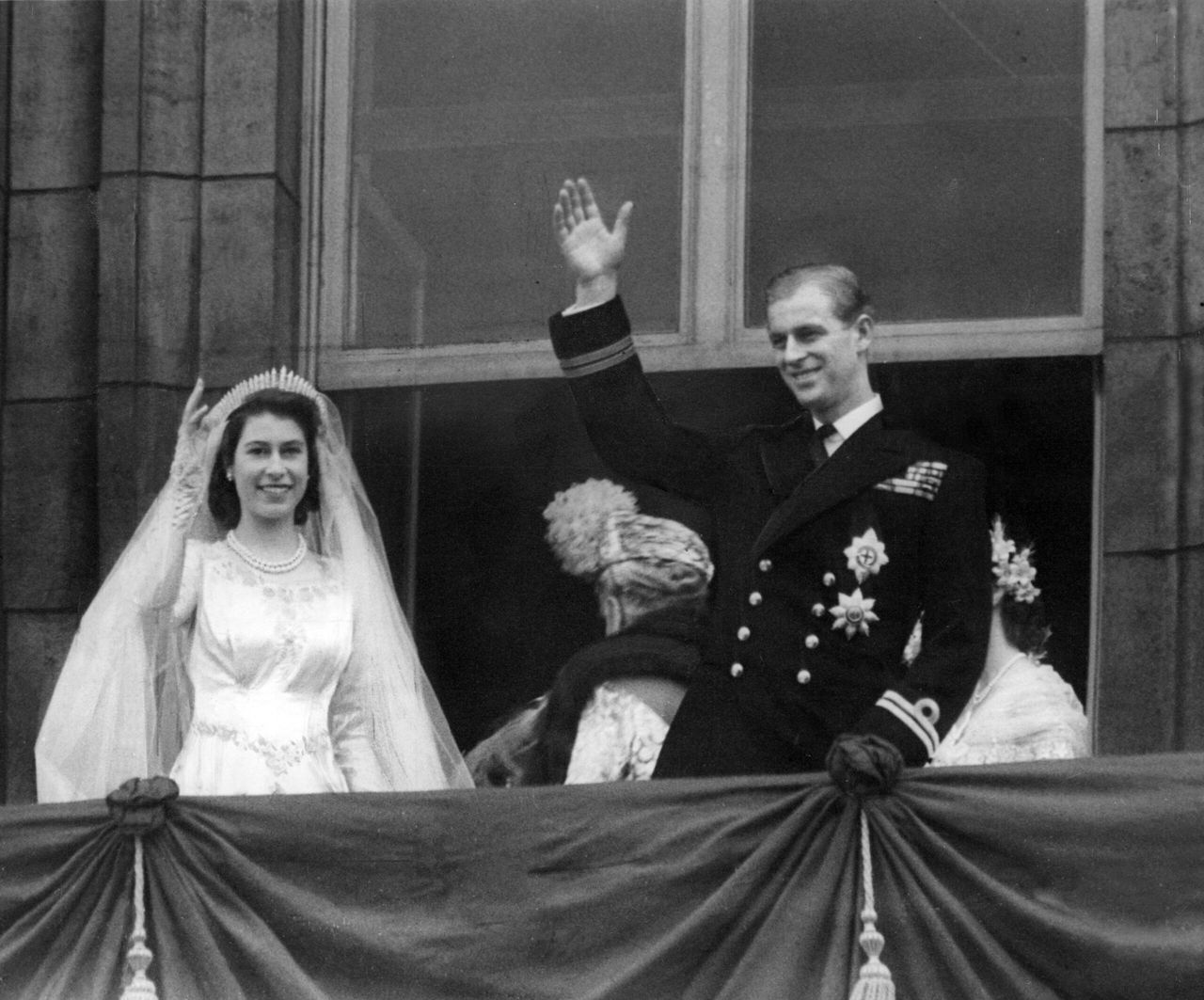 Royal Wedding of Princess Elizabeth (Queen Elizabeth II) and Prince Philip (Duke of Edinburgh) At Westminster Abbey on 20th November 1947. Picture shows the couple on the balcony at Buckingham Palace waving at the crowds.
©Northcliffe Collection/Solo Syndication