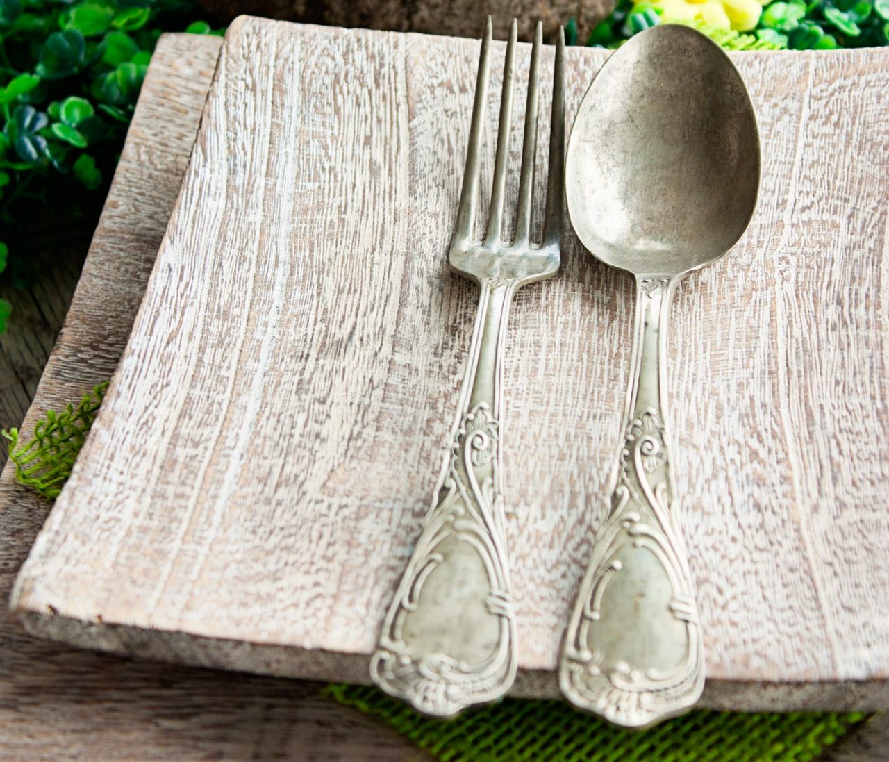 Restaurant menu series. Easter place setting. Fork and knife in rustic country table setting
