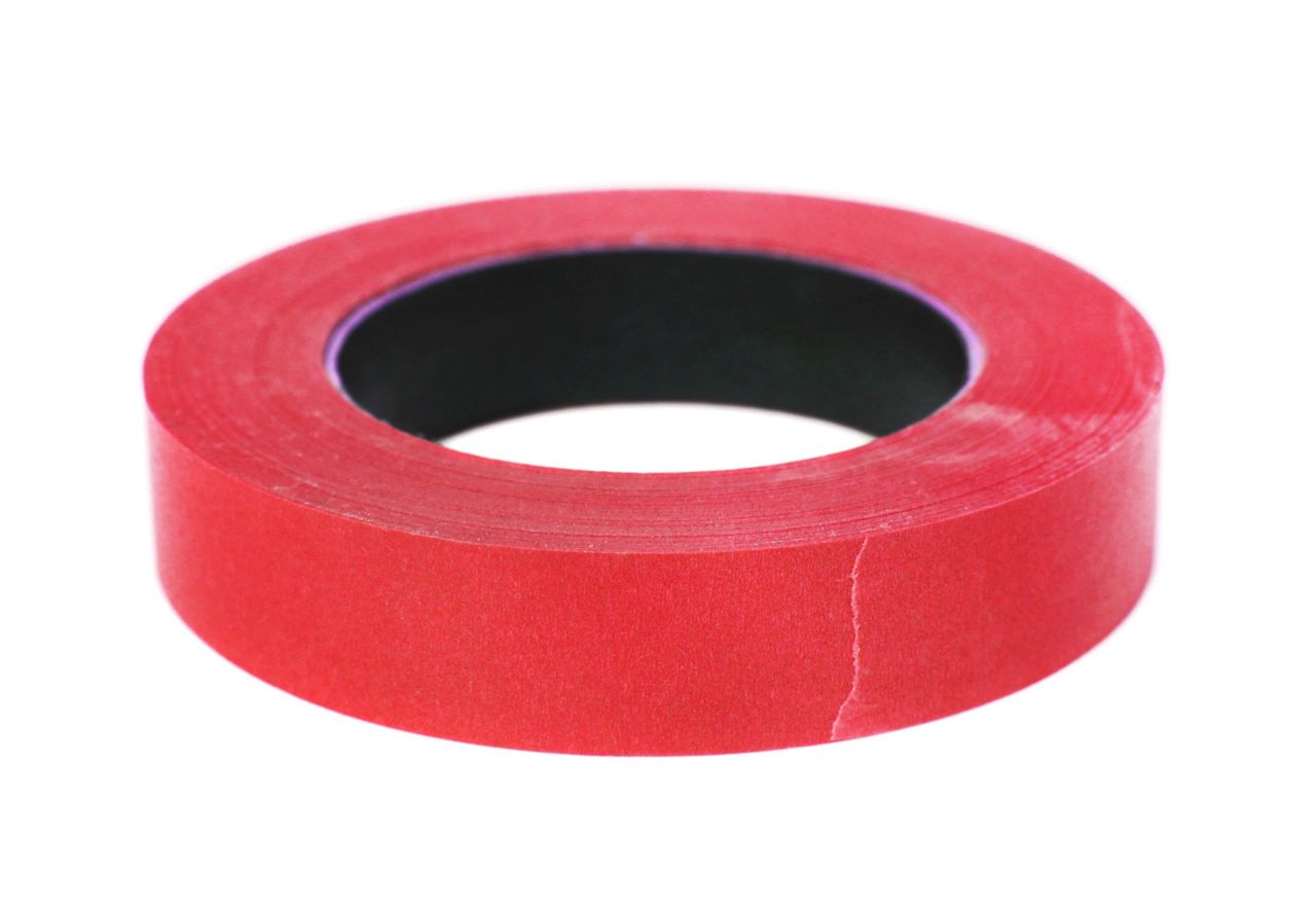 Roll of red tape isolated on white.
