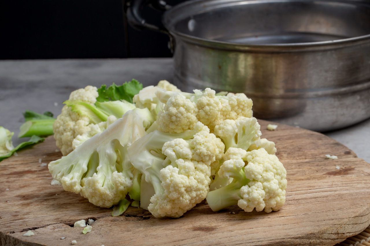Fresh Cauliflower Prepare for cooking on grey table