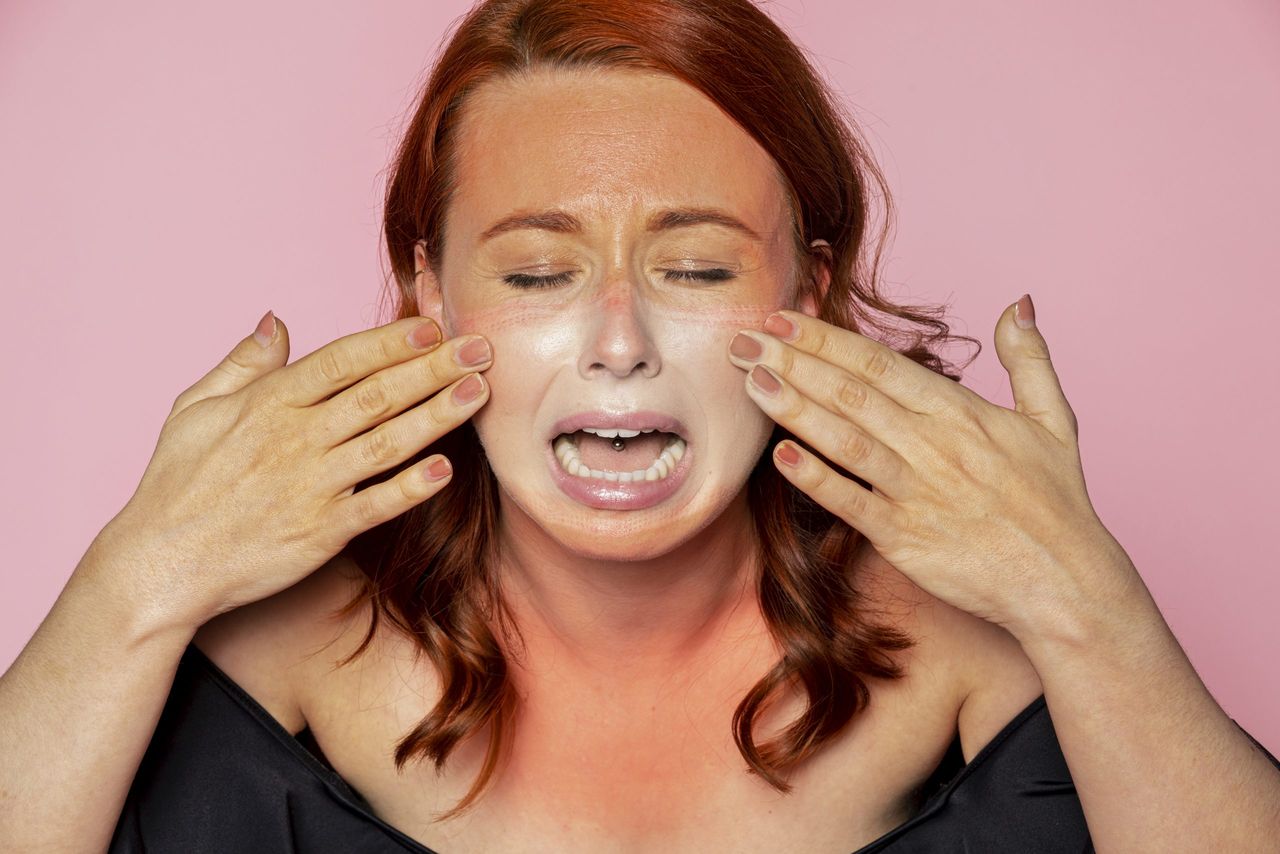 Face mask tan line on an upset woman's face