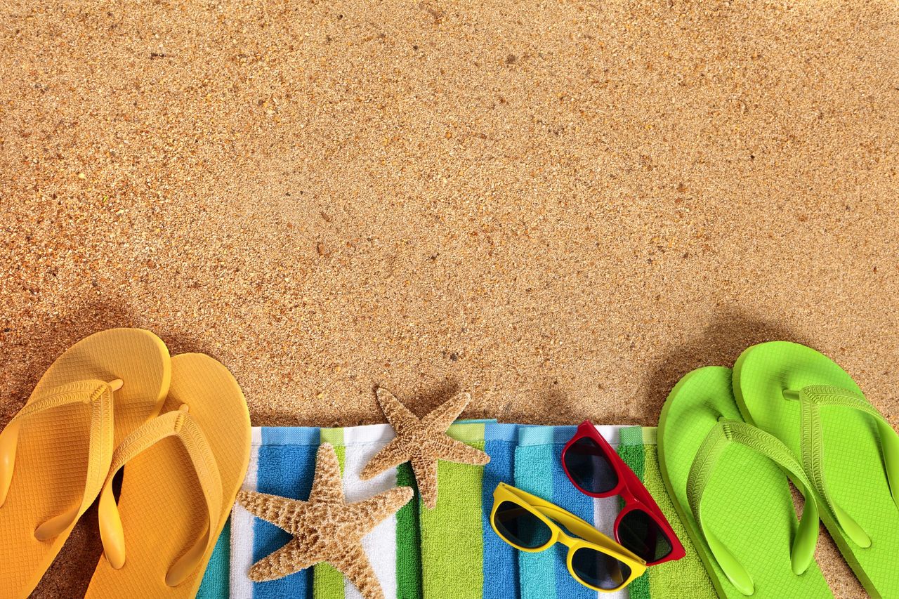 Caribbean summer beach background, sunglasses, couple sunbathing, copy space