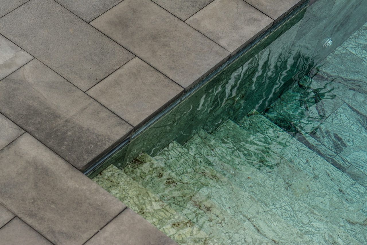 The clear water of a swimming pool during daytime