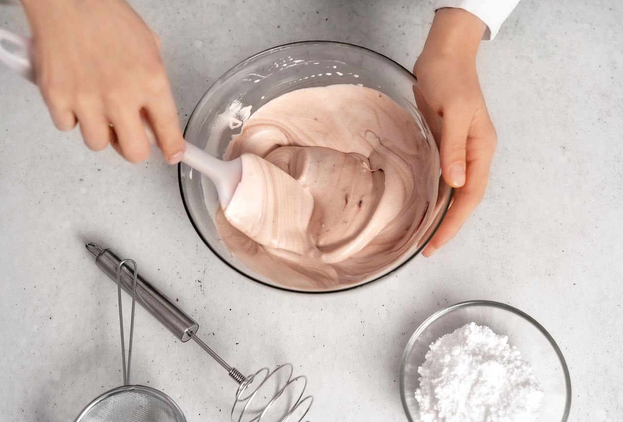 Young woman making chocolate cream. Delicious food concept. Great design for any purposes. Flat lay style.