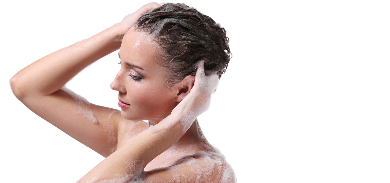 Soap foam, wash. Woman on a white background