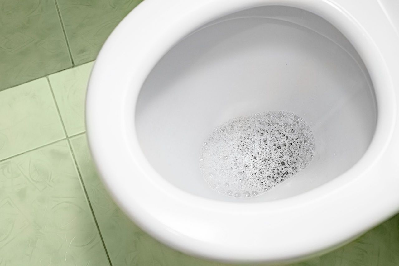 Bathroom cleaning, toilet cleaning. The process of flushing the toilet. Perfect cleanliness.