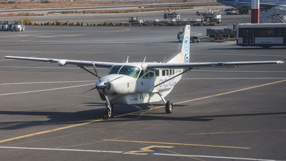 Cessna 208B Grand Caravan aircraft of Cycladic Air spotted at Heraklion International Airport Nikos Kazantzakis in Crete island. Cycladic is a small new airline serving direct passenger flights between the Aegean islands. The airline carrier offers inter-island cost-effective service and affordable luxury island hopping in the Greek islands, operated by iFLY Aviation Services. The airplane type used is Cessna Grand Caravan EX with the ability to carry 8 to 12 passengers. The single-engine turboprop propeller plane is a strutted high-wing Cessna 208 Caravan with fixed tricycle landing gear, the specific has the registration tail number SX-AQB. Heraklion, Crete, Greece on October 2023 (Photo by Nicolas Economou/NurPhoto via Getty Images)